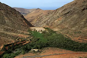 Isolated Prints: Dam and reservoir partially silted up by sediment