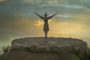 Significance Prints: Dance with Daggers Monument stands against the sunset in Verkhny Zgid Village