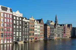 Damrak Prints: Dancing houses at Damrak and tower of Oude Kerk Amsterdam Church