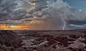 Mood Prints: Dark clouds gather over Kachina Point as a storm approaches Petrified Forest National Park during sunset in Arizona