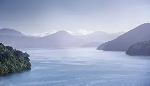 Bays Prints: Dawn breaks over misty bays and mountains in Marlborough Sounds, South Island, New Zealand