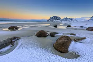 Boulders Prints: Dawn illuminates the rocks shaped by wind surrounded by fresh snow
