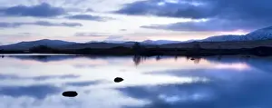 Blue Colour Prints: Dawn view of Loch Ba reflecting the sky and distant snow-capped mountains