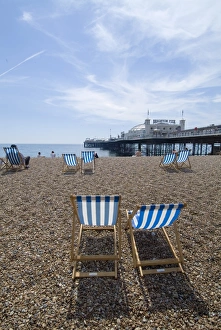 P Ier Prints: Deck chairs and pier, Brighton Beach, Brighton, Sussex, England, United Kingdom, Europe