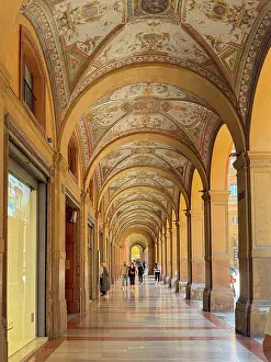 Portico Prints: Decorated portico along Via Farini showcases arches and artwork in Bologna Italy