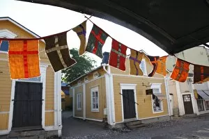 Images Dated 21st June 2009: Decorative flags and medieval wooden houses, Porvoo, Uusimaa, Finland, Scandinavia