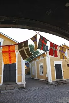 Decorative flags and medieval wooden houses, Porvoo, Uusimaa, Finland, Scandinavia