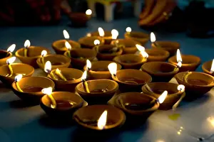 Flames Prints: Deepak lights (oil and cotton wick candles) lit for domestic decoration to celebrate the Diwali festival