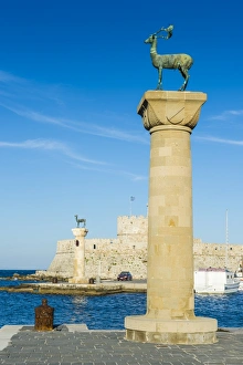 The deer, symbol of the city, at the entrance to Mandraki harbour, the Medieval Old