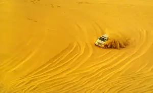 Qatar Prints: Desert safari adventure in 4x4 vehicle bashing side to side through the desert dunes