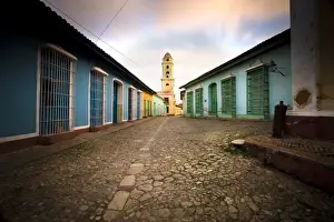 Cobble Stone Prints: Deserted cobbled street looking towards the bell tower of the Inglesia y Convento de San Francisco off Plaza Major