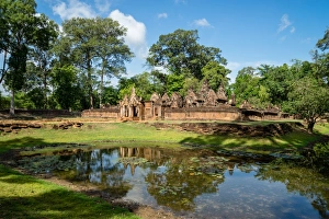 Traditionally Cambodian Prints: A deserted temple reflected in a lake in Siem Reap, Cambodia, Indochina, Southeast Asia