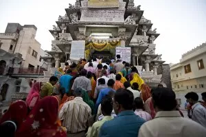 Images Dated 18th October 2009: Devotees queuing to do puja at dusk at Kankera festival, after Diwali celebrations
