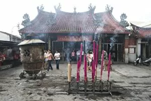 Devotional incense sticks burning outside the Goddess of Mercy Chinese temple