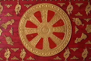 Images Dated 1st August 2006: Dharma Wheel at Wat Si Muang, Vientiane, Laos, Indochina, Southeast Asia, Asia