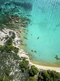 Paddling Prints: Diaporos island with wild beaches and kayak on the turquoise water