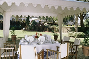 Bivouac Prints: Dining under tented awnings in the garden with croquet