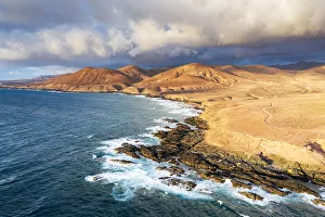 Dirt Road Prints: Dirt road crossing the desert down to Playa de la Solapa beach, Atlantic Ocean, Pajara