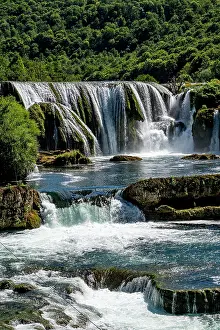 Flowing Prints: Discover Strbacki buk waterfall surrounded by green hills in Bosnia and Herzegovina's Una National Park