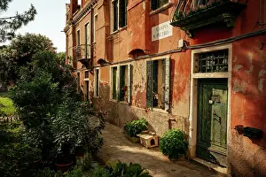 Facades Prints: Discovering hidden corners of a quiet street in Venice's La Tana neighborhood in the afternoon light in Veneto