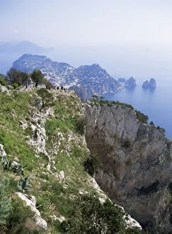 Dis tant Capri village and Faraglioni Rocks