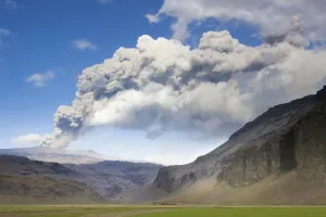 Eruption Prints: Distant view towards mountains with the ash plume of the Eyjafjallajokull eruption in the distance