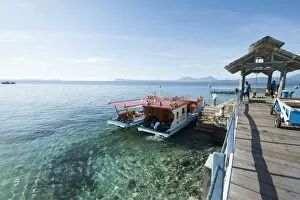 Dive boats at Gangga Island jetty, Sulawesi, Indonesia, Southeast Asia, Asia
