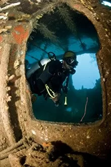 Diver inside the wreck of the Lesleen M freighter, sunk as an artificial reef in 1985 in Anse Cochon Bay, St