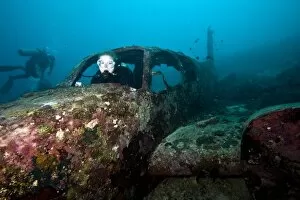 Images Dated 27th December 2011: Diver inside the wreck of a four seater airplane, Philippines, Southeast Asia, Asia