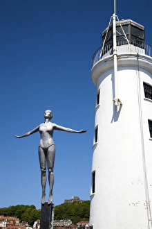 The Diving Belle Sculpture and Lighthouse on Vincents Pier, Scarborough, North Yorkshire, Yorkshire, England, United Kingdom, Europe