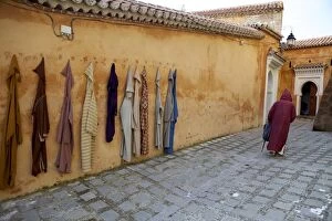 Images Dated 15th March 2010: Djellaba garments hanging on a wall, Chefchaouen, Morocco, North Africa, Africa