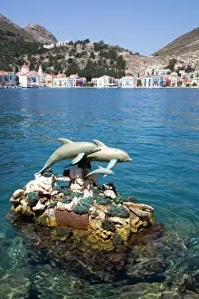 Watercraft Prints: Dolphin statues in the harbor at Megisti Bay in Kastellorizo