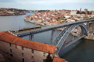 Bridges Prints: The Dom Luis 1 Bridge over the River Douro showing Porto Metro light rail in transit and Arrabida Bridge in background