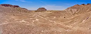 Bentonite Prints: A dome shaped hill of purple bentonite with a rocky flat top in Petrified Forest National