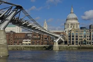 Millennium Bridge Collection: The Dome of St. Pauls Cathedral and Millennium Bridge over the River Thames