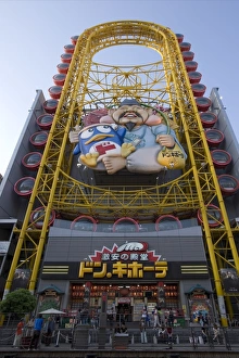 Don Quixote discount shop with Ferris wheel-like attraction in the Dotonbori district of Don Quixote discount shop with Ferris wheel-like attraction in the Dotonbori district of