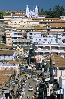 Hill Station Prints: Downtown area overlooked by large Christian church
