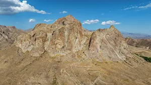 Geological Prints: Dramatic aerial view of Alinja castle amidst rugged landscape in Nakhchivan region of Azerbaijan showcasing mountains