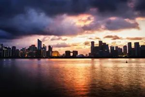 Business District Prints: Dramatic clouds over Qianjiang River with skyline of Hangzhous new business district