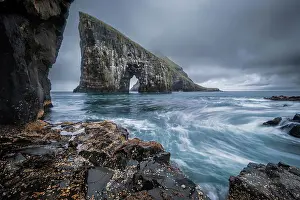 Crashing Waves Prints: Dramatic Sea Arch of Drangarnir and waves crashing on the Faroe Islands coast