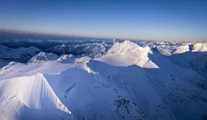 Engadine Prints: Dramatic sky at dawn on the snowcapped Piz Palu, Bellavista, Piz Zupo and Monte Disgrazia