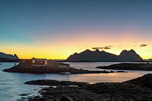Svolvaer Prints: Dramatic sky at dawn over traditional rorbu