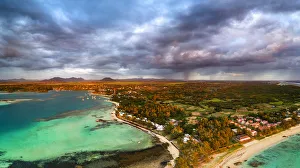Dramatic sky at dawn over Trou d Eau Douce coastline, aerial view, Flacq district