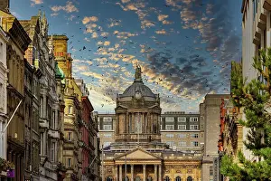 Old City Prints: Dramatic sky over historic city street with classic architecture and warm sunlight in Liverpool