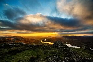 : Dramatic sunset from Gummers How and view across Windermere towards the Furness fells