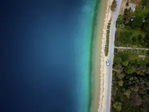 Porto Prints: Drone aerial view of camper van drone top aerial view parked on a wild beach in Porto Koufo