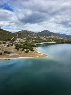 Bliss Prints: Drone aerial view of camper vans parked on a wild spot at Lake Polyfyto