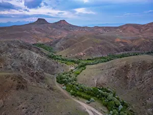Cappadocia Prints: Drone aerial view captures Akkoy dam lake landscape at sunset in Cappadocia