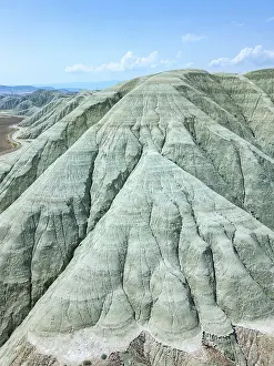 Vast Prints: Drone aerial view of grey mountains on dry landscape in Turkey's Ankara region showing unique geological formations