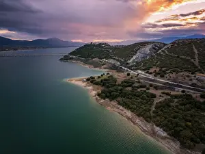 Discover Prints: Drone aerial view of Lake Polyfyto mountain landscape and high bridge of Servia Neraida at sunset